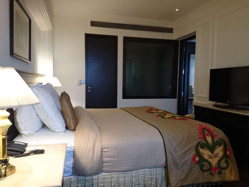 The Ashok, New Delhi Nova Deli Quarto foto A bedroom at the Taj Mahal Palace